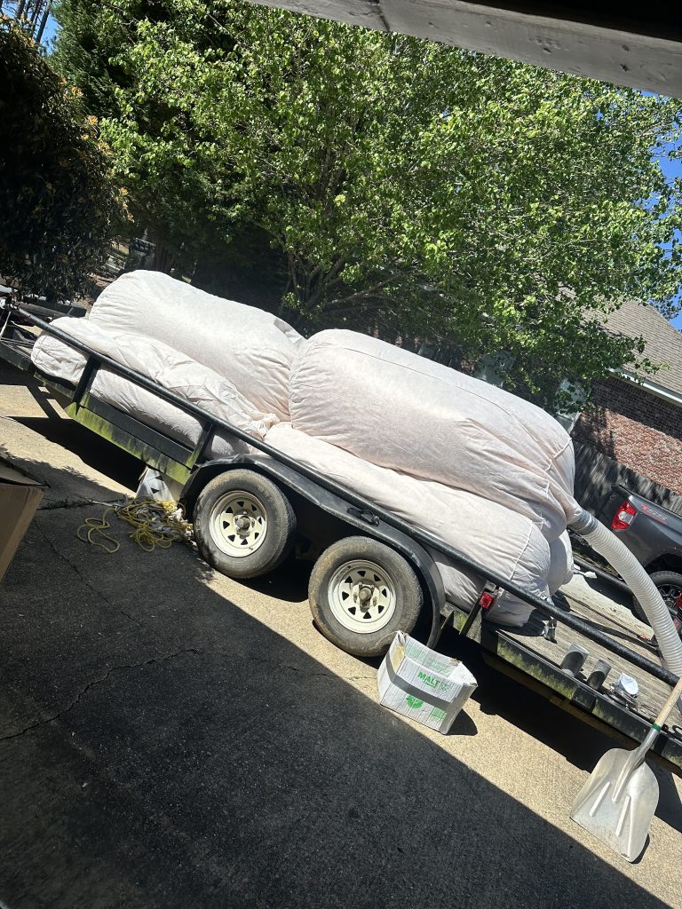 Pine Belt Insulation truck removing old Blow in fiberglass 